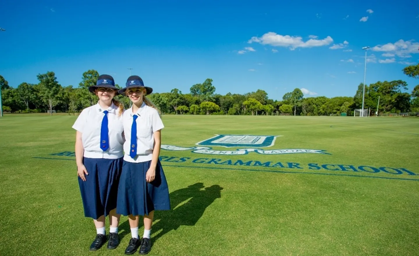 2017-grammar-logo-on-the-daphne-welch-oval-with-then-head-girls-lucy-duke-(2017)-and-elizabeth-prins-(2017)